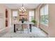An inviting dining room with ample natural light, stylish decor, and comfortable seating at 3143 Elmira St, Denver, CO 80238