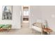 Hallway leading to the main bathroom with a soaking tub at 3143 Elmira St, Denver, CO 80238