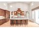 Bright kitchen features a large island with seating and granite counters at 3143 Elmira St, Denver, CO 80238