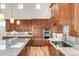 Spacious kitchen with stainless steel appliances and stone countertops at 3143 Elmira St, Denver, CO 80238