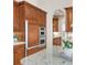 Kitchen featuring a full size refrigerator and stainless double oven at 3143 Elmira St, Denver, CO 80238