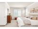 Brightly lit main bedroom with shuttered windows and plush bedding at 3143 Elmira St, Denver, CO 80238
