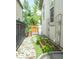 Landscaped side yard with rock ground cover, a small garden and greenery at 3143 Elmira St, Denver, CO 80238