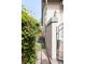 Side yard featuring a side gate and professional landscaping at 3143 Elmira St, Denver, CO 80238