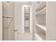 Walk-in closet with built-in shelving and ample storage space at 3143 Elmira St, Denver, CO 80238