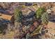 Overhead view of a property displaying garden plots, backyard patio and surrounding foliage at 7668 S Locust St, Centennial, CO 80112