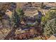 Overhead view of home with garden plots, patio, and mature trees at 7668 S Locust St, Centennial, CO 80112