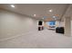 Spacious finished basement with entertainment area offering carpet and modern decor at 7668 S Locust St, Centennial, CO 80112