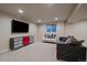 Finished basement offers a comfortable seating area and entertainment unit at 7668 S Locust St, Centennial, CO 80112