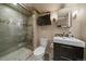 Updated bathroom with walk-in shower, bench seat and modern fixtures at 7668 S Locust St, Centennial, CO 80112