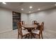 Basement dining area featuring built-in bar and seating for four at 7668 S Locust St, Centennial, CO 80112