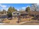 Charming two-story home featuring a two-car garage and established landscaping at 7668 S Locust St, Centennial, CO 80112