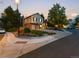 Corner lot home boasts mature landscaping and a two-car garage at 7668 S Locust St, Centennial, CO 80112