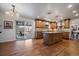 The kitchen offers an island, lots of cabinets and stainless steel appliances, and a view to the yard at 7668 S Locust St, Centennial, CO 80112