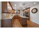Beautiful kitchen features granite countertops, a central island, and stainless steel appliances at 7668 S Locust St, Centennial, CO 80112