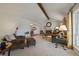 Spacious living room with fireplace and vaulted ceiling flowing into the dining area for easy entertaining at 7668 S Locust St, Centennial, CO 80112