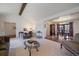 Open-concept living room flowing into the dining area, perfect for gatherings and everyday living at 7668 S Locust St, Centennial, CO 80112