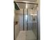 Modern shower with glass door and a built-in niche, designed for a luxurious bathing experience at 7668 S Locust St, Centennial, CO 80112