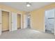 Bright bedroom with connecting doors to a bathroom and closet at 862 N Uvalda St, Aurora, CO 80011