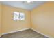 A bright bedroom with wood-look floors and a large window for natural light at 862 N Uvalda St, Aurora, CO 80011