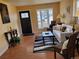 Inviting living room featuring a front door, plush sofa, and modern decor at 862 N Uvalda St, Aurora, CO 80011