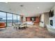 Spacious common room with comfortable seating, a fireplace, a large TV, and scenic views at 1625 Larimer St # 1104, Denver, CO 80202