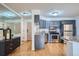 Updated kitchen with stainless steel appliances, sleek countertops, and ample cabinet space, with luxury vinyl plank flooring at 1625 Larimer St # 1104, Denver, CO 80202