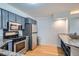 Functional kitchen features stainless steel appliances, stylish grey cabinets, and a functional layout for easy cooking at 1625 Larimer St # 1104, Denver, CO 80202