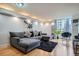 Cozy living room with comfortable seating, modern decor, city views through large windows, and luxury vinyl plank flooring at 1625 Larimer St # 1104, Denver, CO 80202
