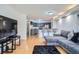 Open floor plan showcases a modern kitchen with stainless appliances and living area with plush seating at 1625 Larimer St # 1104, Denver, CO 80202