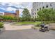 Well-maintained outdoor space with green grass, BBQ grill, and landscaping at 1625 Larimer St # 1104, Denver, CO 80202
