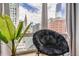 Cozy sitting area with cityscape view through large windows, offering natural light and urban charm at 1625 Larimer St # 1104, Denver, CO 80202