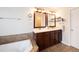 Bathroom with a double sink vanity and tile flooring at 23549 E Ottawa Pl, Aurora, CO 80016