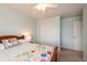 Cozy bedroom with a ceiling fan and sliding closet doors at 23549 E Ottawa Pl, Aurora, CO 80016