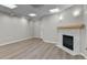 Living room with fireplace and hardwood floors at 3872 S Dallas St # 7-101, Aurora, CO 80014