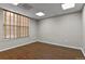 Spacious office featuring wood-look floors and window blinds at 3872 S Dallas St # 7-101, Aurora, CO 80014