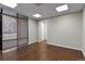 Bright office featuring wood-look floors and window blinds at 3872 S Dallas St # 7-101, Aurora, CO 80014