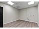 Spacious office with wood-look floors and large windows at 3872 S Dallas St # 7-101, Aurora, CO 80014