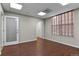 Bright office space with wood-look floors and window at 3872 S Dallas St # 7-101, Aurora, CO 80014