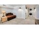 Cozy basement space with plush carpeting, modern lighting, and convenient laundry area at 4478 S Acoma St, Englewood, CO 80110