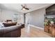 Comfortable living room with hardwood floors, stylish decor, and easy access to other rooms at 4478 S Acoma St, Englewood, CO 80110