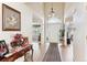 Bright foyer featuring hardwood floors, high ceilings, and decorative accents, leading to the living spaces at 1011 S Valentia St # 1, Denver, CO 80247