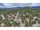Aerial shot of homes nestled among pine trees in a mountain community at 31190 Cinnamonwood, Evergreen, CO 80439
