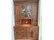 Elegant, built-in wooden cabinet with glass doors and ample storage space, a focal point for the dining room at 31190 Cinnamonwood, Evergreen, CO 80439