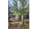 Charming home featuring a stone facade, well-maintained landscaping, and a cozy bench near the entrance at 31190 Cinnamonwood, Evergreen, CO 80439