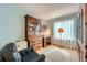 Cozy office space with hardwood floors, ample storage, a desk, and natural light at 31190 Cinnamonwood, Evergreen, CO 80439