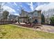 Expansive backyard featuring a spacious wooden deck with a pergola and built-in fire pit area at 270 S Locust St, Denver, CO 80224