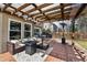 Backyard deck with overhead pergola, outdoor seating, and patio heater at 270 S Locust St, Denver, CO 80224