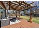 Inviting backyard features a wooden deck, pergola, string lights, and shade at 270 S Locust St, Denver, CO 80224