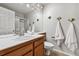 Neutral bathroom features a shower, white towels and cute whimsical fish accents at 270 S Locust St, Denver, CO 80224